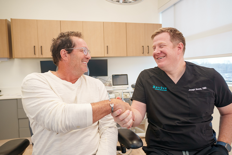 Dr. Boone shaking patient's hand